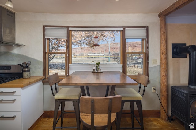 232 E 100 S, Moab, UT 84532 - dining area with wood-type flooring and a wood stove