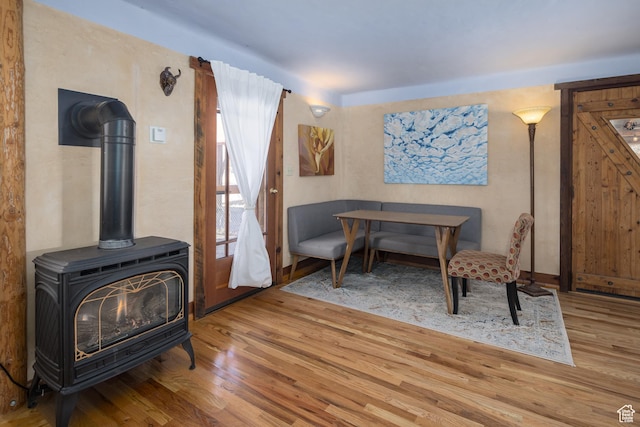 232 E 100 S, Moab, UT 84532 - living area with light hardwood / wood-style floors and a wood stove