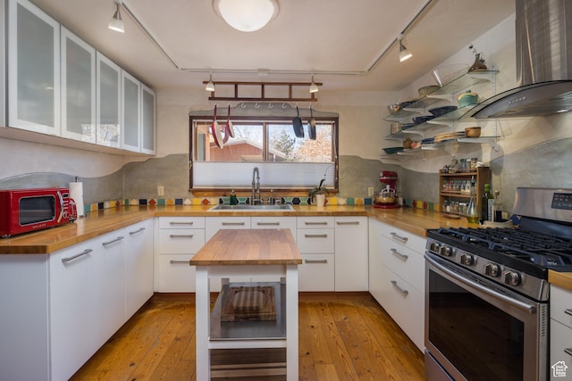 232 E 100 S, Moab, UT 84532 - kitchen with stainless steel range with gas cooktop, butcher block counters, sink, and white cabinets