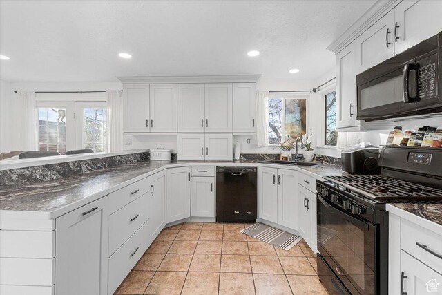 180 W 300 S, Fillmore, UT 84631 - kitchen with white cabinets, plenty of natural light, sink, and black appliances