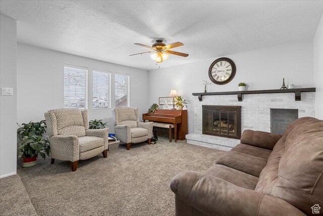 180 W 300 S, Fillmore, UT 84631 - living room featuring ceiling fan, carpet flooring, a fireplace, and a textured ceiling