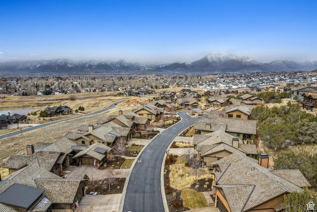 birds eye view of property with a mountain view