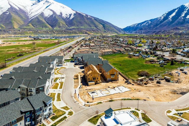 birds eye view of property with a mountain view