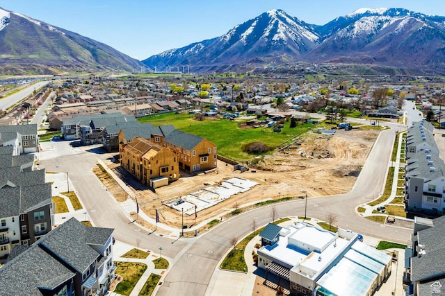 birds eye view of property with a mountain view