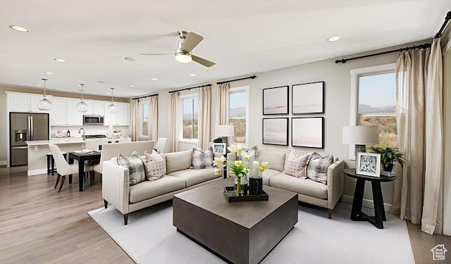 2144 W 3930 S Unit 21, Hurricane, UT 84737 - living room with plenty of natural light, light hardwood / wood-style floors, and ceiling fan