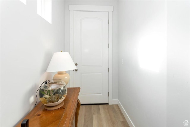 1088 N Freeman Dr, Saratoga Springs, UT 84045 - doorway to outside with baseboards and light wood-type flooring