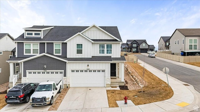 1088 N Freeman Dr, Saratoga Springs, UT 84045 - view of front of home with a residential view, concrete driveway, board and batten siding, an attached garage, and roof with shingles