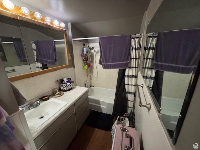 353 S 9th St, Montpelier, ID 83254 - bathroom featuring shower / tub combo, wood finished floors, vanity, and vaulted ceiling
