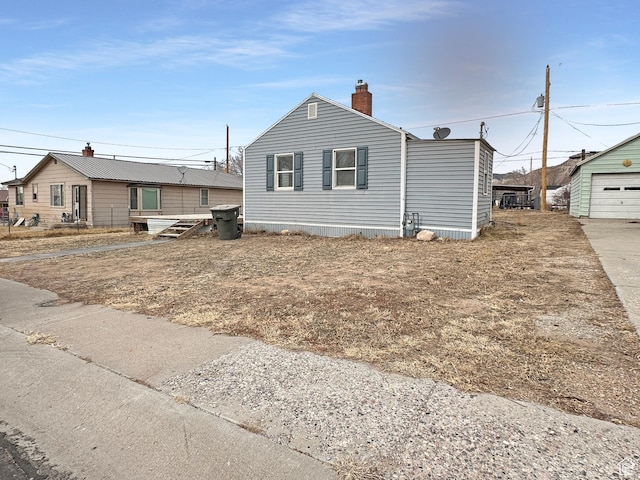 117 Grassy Dr, East Carbon, UT 84520 - view of front of property featuring a garage and an outbuilding