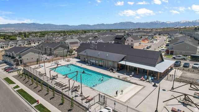view of swimming pool featuring a mountain view and a patio area
