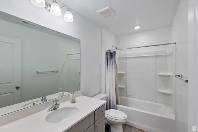 full bathroom featuring vanity, toilet, and shower / tub combo