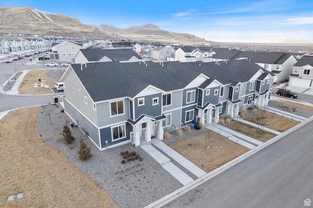 drone / aerial view featuring a mountain view