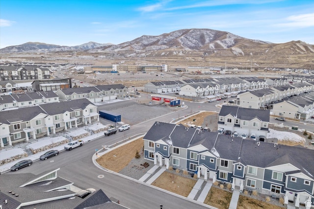 birds eye view of property with a mountain view