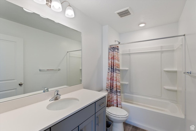 full bathroom featuring vanity, shower / tub combo, wood-type flooring, and toilet