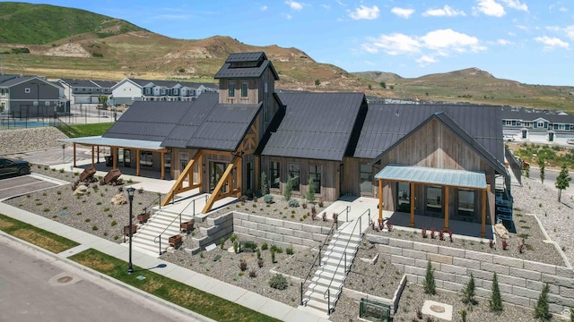 rear view of house featuring a mountain view