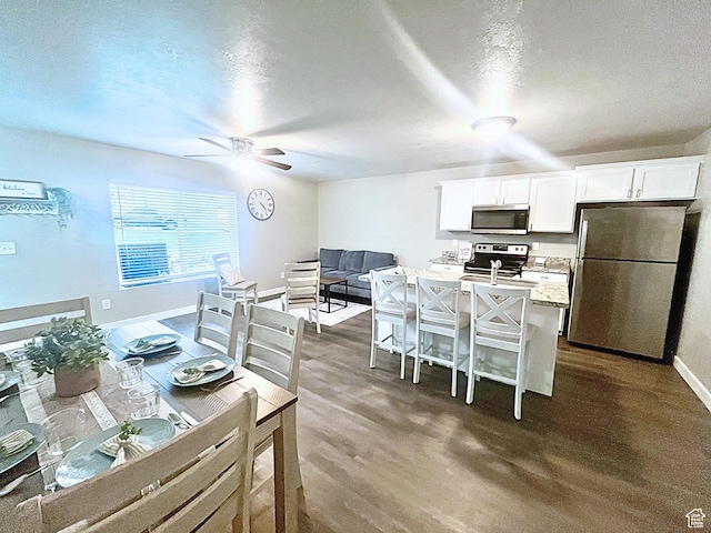14368 S Penrhy Ct, Herriman, UT 84096 - dining area featuring ceiling fan, baseboards, and dark wood-style flooring