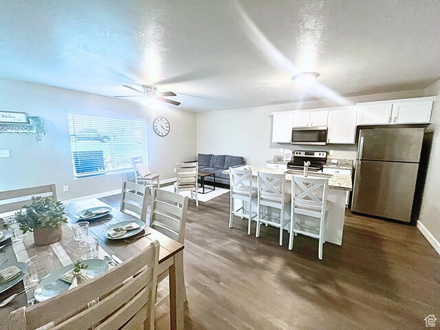 14368 S Penrhy Ct, Herriman, UT 84096 - dining area featuring ceiling fan, baseboards, and dark wood finished floors
