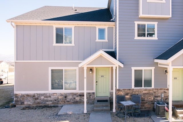 14368 S Penrhy Ct, Herriman, UT 84096 - multi unit property featuring stone siding, roof with shingles, central air condition unit, and board and batten siding