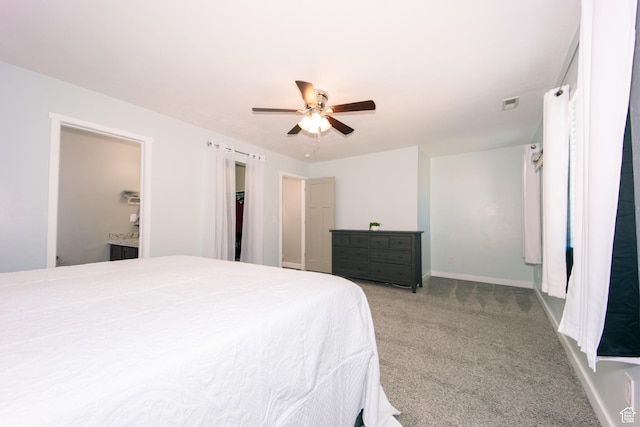 14368 S Penrhy Ct, Herriman, UT 84096 - bedroom with light carpet, baseboards, a ceiling fan, and ensuite bath