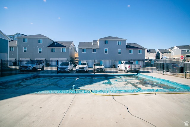 14368 S Penrhy Ct, Herriman, UT 84096 - community pool with a residential view, fence, and a patio area