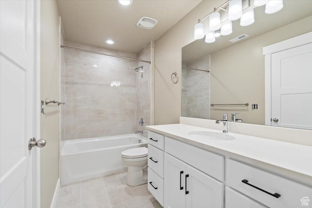 full bathroom featuring vanity, visible vents, tile patterned flooring, bathing tub / shower combination, and toilet