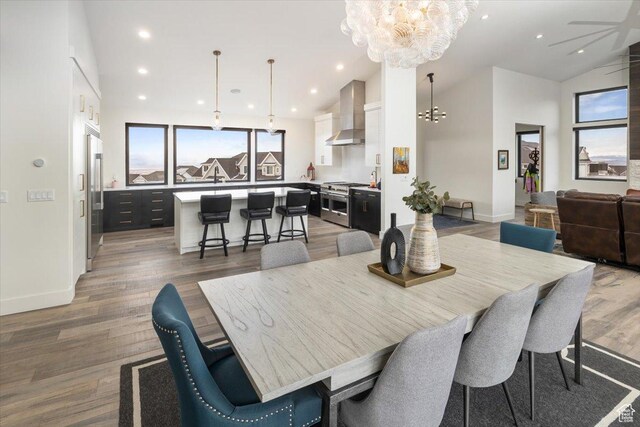 3450 N 1930 E, North Logan, UT 84341 - dining room with dark hardwood / wood-style flooring, high vaulted ceiling, and a chandelier