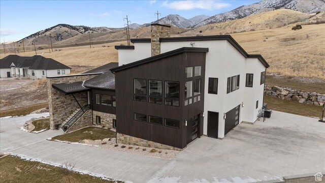 3450 N 1930 E, North Logan, UT 84341 - back of house with a mountain view and a garage