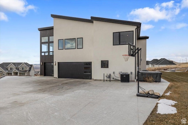3450 N 1930 E, North Logan, UT 84341 - back of property featuring a garage and central AC