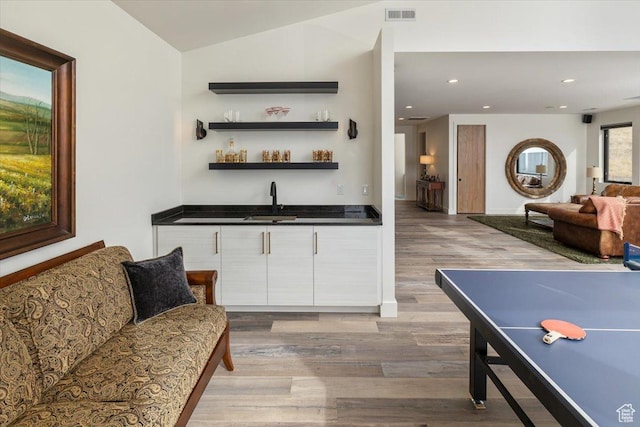 3450 N 1930 E, North Logan, UT 84341 - bar featuring white cabinetry, sink, light hardwood / wood-style floors, and lofted ceiling