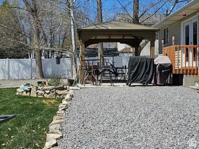 view of yard featuring a gazebo, fence, and a patio