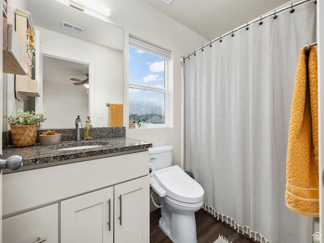 1802 E Magnolia Cir, Eagle Mountain, UT 84005 - bathroom with vanity, hardwood / wood-style flooring, and toilet