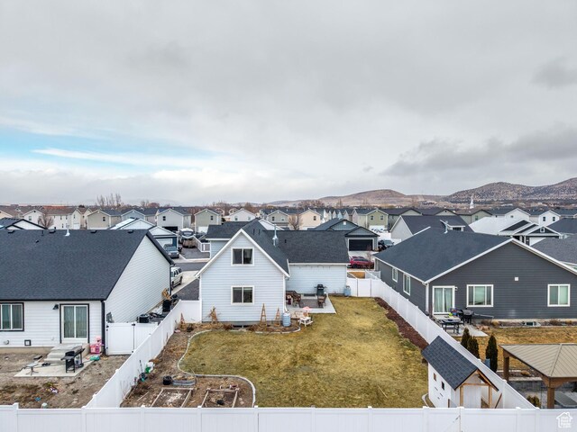 1802 E Magnolia Cir, Eagle Mountain, UT 84005 - back of house with a mountain view and a lawn