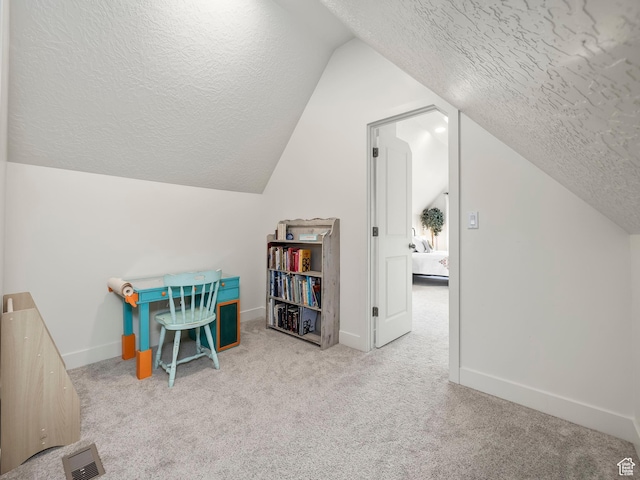 1802 E Magnolia Cir, Eagle Mountain, UT 84005 - rec room featuring lofted ceiling, light colored carpet, and a textured ceiling