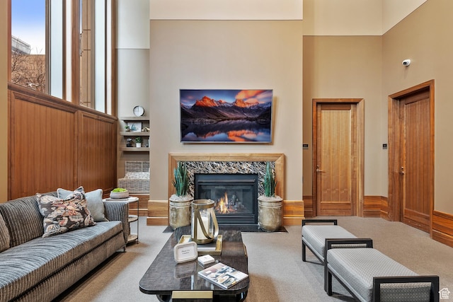 99 W S Temple St S Unit 2201, Salt Lake City, UT 84101 - living room with a fireplace, a high ceiling, and carpet flooring