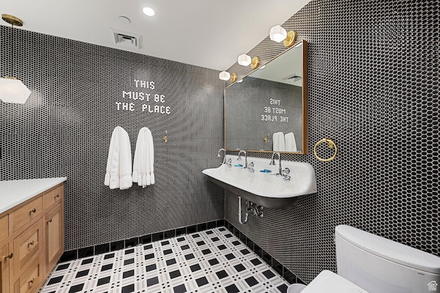 99 W S Temple St S Unit 2201, Salt Lake City, UT 84101 - bathroom featuring vanity, tile walls, and toilet