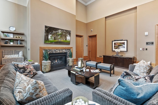 99 W S Temple St S Unit 2201, Salt Lake City, UT 84101 - living room with ornamental molding, a high ceiling, light carpet, and a high end fireplace