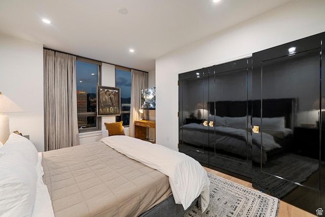 99 W S Temple St S Unit 2201, Salt Lake City, UT 84101 - bedroom featuring a closet and hardwood / wood-style flooring
