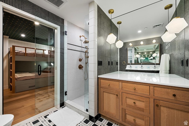99 W S Temple St S Unit 2201, Salt Lake City, UT 84101 - bathroom with vanity and an enclosed shower