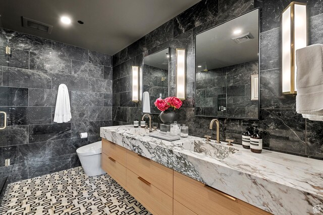 99 W S Temple St S Unit 2201, Salt Lake City, UT 84101 - bathroom with tile walls, vanity, and toilet