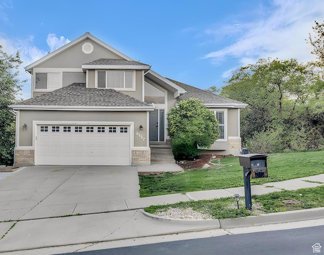 2152 E 3325 N, Layton, UT 84040 - view of front of property with driveway, a garage, brick siding, a front lawn, and stucco siding