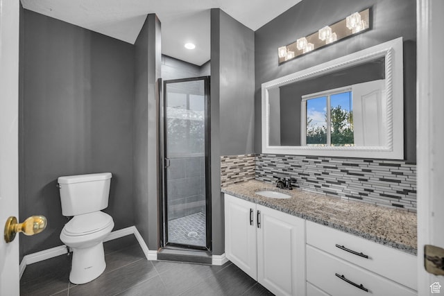 2152 E 3325 N, Layton, UT 84040 - full bath featuring backsplash, tile patterned flooring, a stall shower, baseboards, and toilet