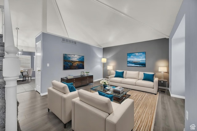 2152 E 3325 N, Layton, UT 84040 - living area featuring baseboards, visible vents, wood finished floors, and lofted ceiling