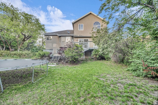 2152 E 3325 N, Layton, UT 84040 - view of yard with stairway, a wooden deck, and a trampoline