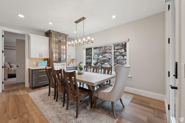 13299 S Laurel Park Ln, Draper, UT 84020 - dining room with recessed lighting, light wood finished floors, baseboards, and a chandelier