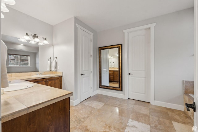 13299 S Laurel Park Ln, Draper, UT 84020 - bathroom featuring baseboards and vanity
