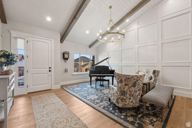 13299 S Laurel Park Ln, Draper, UT 84020 - interior space with a notable chandelier, a decorative wall, baseboards, vaulted ceiling with beams, and light wood-type flooring