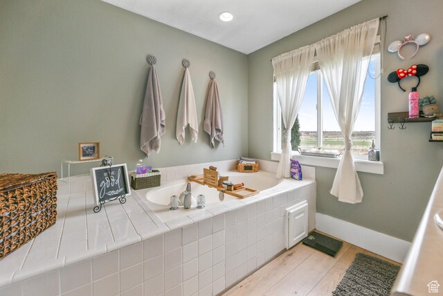 888 W Vahe St S, Draper, UT 84020 - bathroom with a bath, baseboards, and wood finished floors