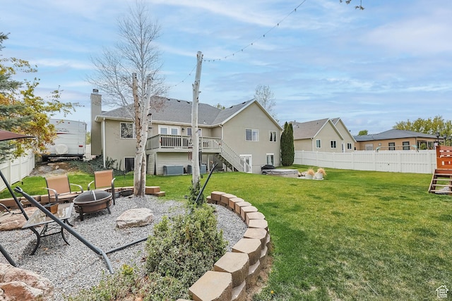 888 W Vahe St S, Draper, UT 84020 - rear view of property with an outdoor fire pit, fence, a yard, a wooden deck, and stairs