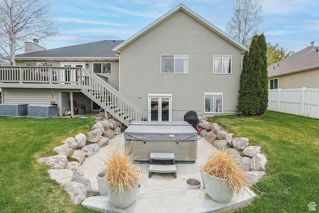 888 W Vahe St S, Draper, UT 84020 - back of property featuring stairway, fence, a lawn, a hot tub, and a deck