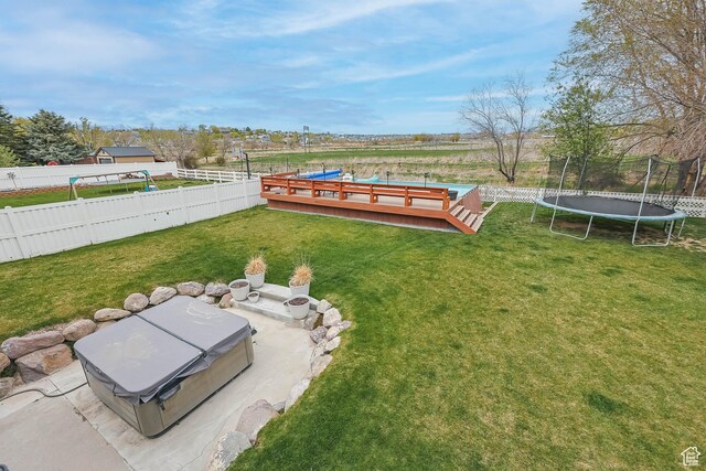 888 W Vahe St S, Draper, UT 84020 - view of yard featuring a fenced backyard, a deck, and a trampoline